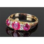 18 carat gold ruby and diamond set ring, with three rubies at approximately a total weight of 2.18