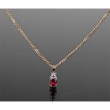 Ruby and diamond necklace. The 18 carat gold chain and mount with a diamond above a ruby