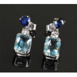 Pair of white metal aquamarine, diamond and sapphire earrings, topped with a sapphire above a