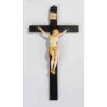 19th Century ivory Corpus Christi. The figure on a black ebonised cross with ivory INRI tablet,