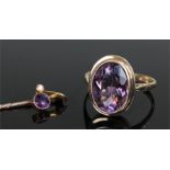 20th Century amethyst and 9ct gold dress ring, the oval facet cut stone within a millegrain