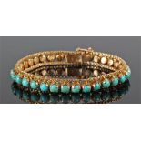 14 carat gold turquoise bracelet, the bracelet with thirty three turquoise stones, 19cm long