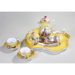 Sevres yellow porcelain tea set, eight pieces with a yellow ground, pictorial scene of courting