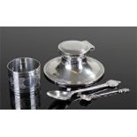 Silver capstan inkwell together with two silver spoons and a silver napkin holder, various dates and