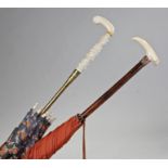 Two Victorian parasols, the first with a carved ivory handle, the second with a tuck, (2)