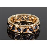 18 carat gold diamond and sapphire set ring, the oval cut sapphires with interspersed diamonds, ring