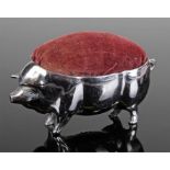 Silver plated novelty pig pin cushion, of large proportions, pad back, 11cm long