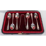 Cased set of Victorian tea spoons, with bright cut decoration, also fitted a matched pair of sugar