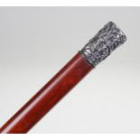 Late 19th Century Chinese white metal topped cane, decorated with Chinese figures near a pagoda