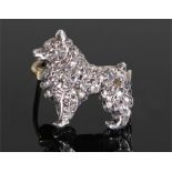 White metal and diamond set brooch, in the form of a dog, set with approximately 0.4 carats of