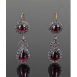 Pair of George III garnet earrings, the pair garnet drop surrounded by diamonds, with a leaf link