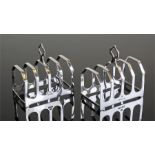 Near pair of silver toast racks, Sheffield 1937 and London 1935, maker Viners Ltd. The four racks