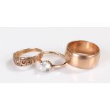 9ct rose gold wedding band together with two stone set dress rings mounted in 9ct gold,