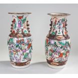 Pair of late 19th Century Chinese vases, polychrome decorated with warring scenes, 43cm high (2)
