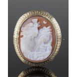 15 carat gold mounted cameo brooch, carved as a pair of classical figures, oval wide gold brooch