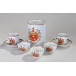 Eight pieces of 18th Century Chinese export armorial porcelains, to include one tankard, two cups,