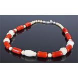 Large Art Deco bakelite and vegetable ivory necklace, with rows of red bakelite beads and