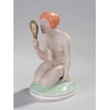 Royal Copenhagen porcelain figure, modelled by Gerhard Henning, a lady crouched looking into a