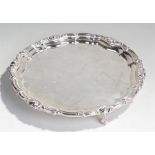 Silver plated tray, with shaped edge, claw and ball feet, 36cm wide
