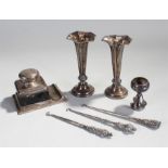Mixed silver, t include a desk inkwell with pen ledge, two silver vases, a silver trophy and