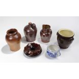 19th Century treacle glaze spittoon, together with a jug, a bottle, a container, a damaged Delft