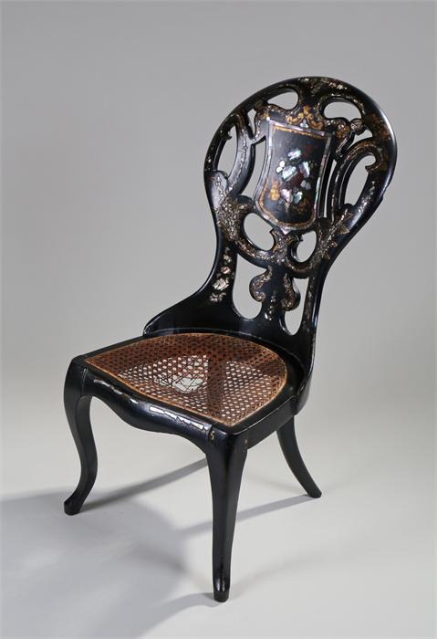 Victorian Papier Mache and mother of pearl inlaid chair, the arched pierced back with gilt swags and