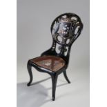 Victorian Papier Mache and mother of pearl inlaid chair, the arched pierced back with gilt swags and