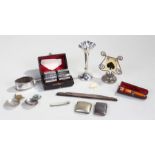 Mixed lot, to include a cigarette holder, a fruit knife, a trump marker, silver flower vase, a