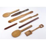 19th Century and later treen implements, to include spoons, a spatula, knife, a mould (8)