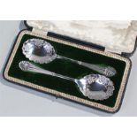 Cased pair of silver plated berry spoons