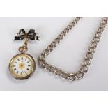 Silver open face pocket watch, the white enamel dial with Roman hours, a ribbon brooch attached,