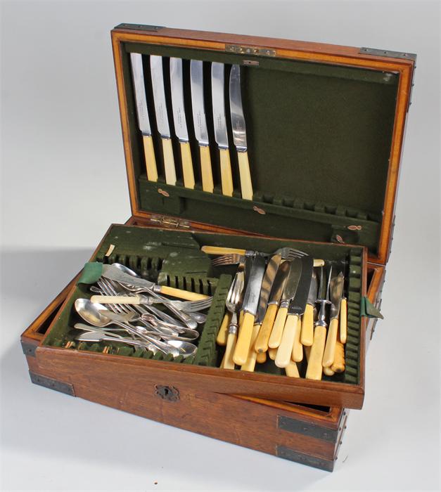 Canteen cutlery, the oak boz container a mix of cutlery