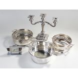 Silver plated wares, to include a candelabra and dishes, together with a clock