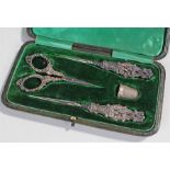 Silver handled sewing set, housed within a leather case