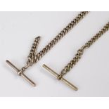 Two pocket watch chains, a silver plated example and a white metal example, (2)