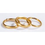 Three 22 carat gold wedding bands, total weight 10.9 grams