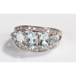 9 carat white gold ring, with pale blue stone surrounded by cubic zirconia, ring size N