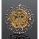 Fran Jos 1915 coin brooch, the coin set within a swirl mount