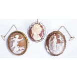 Cameo brooches, to include a Victorian example carved with cupid standing on a chariot, a 9 carat
