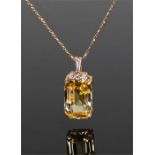 Fine Ceylon yellow sapphire and diamond set pendant, the diamond set top above a 14.806 carat non