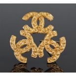 Pair of Chanel gold plated earrings, of circular shield form decorated with interlinking "C"s to the