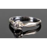 18 carat white gold diamond set ring. The central diamond with high claw mount, ring size O