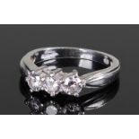 Platinum and diamond set ring, the ring set with three diamonds and wide shoulders, ring size K 1/2