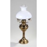 Brass and milk glass oil lamp, the glass chimney with a milk glass shade and brass base, 59cm high