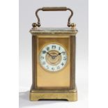 Gilt brass carridge clock. The case with five glass sides and top, enamel chapter ring with Arabic