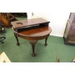 George III style extending dining table, the oval top with a single extra leaf, raised on cabriole