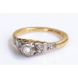Small ladies diamond solitaire ring, set in an 18ct gold and platinum shank