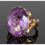 9 carat gold and amethyst set ring, the large amethyst with bow shoulders