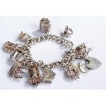 Silver charm bracelet, with charms to include a church ship, stag, helmet, tankard, etc, 64.8 grams,