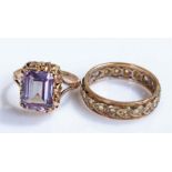 9 carat gold eternity ring, together with a purple glass and 9 carat gold ring, (2)